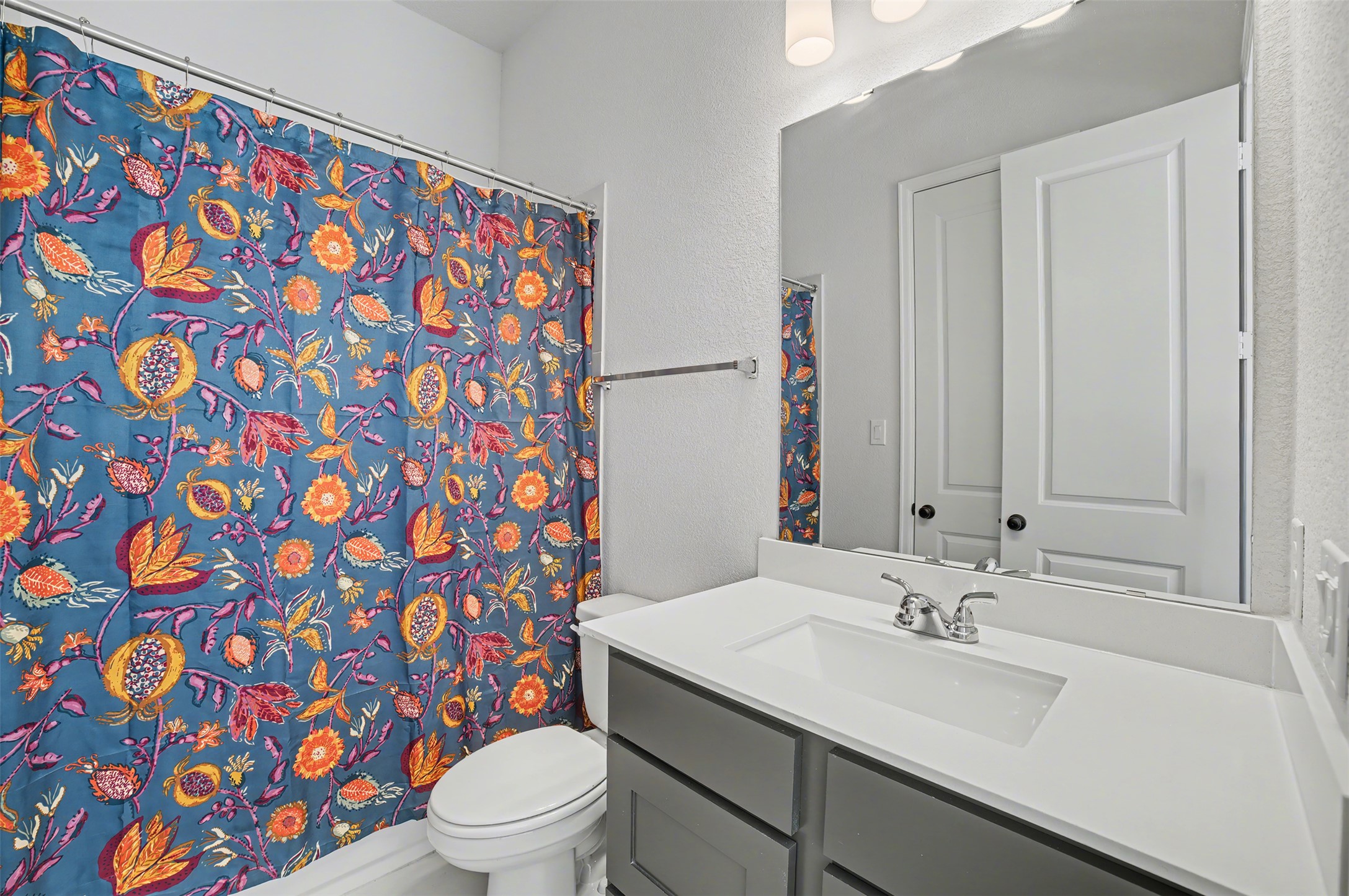 186 Prickly Poppy Loop Kyle, TX 78640 - Photo 27 of 40 a bathroom with a sink and mirror with toilet