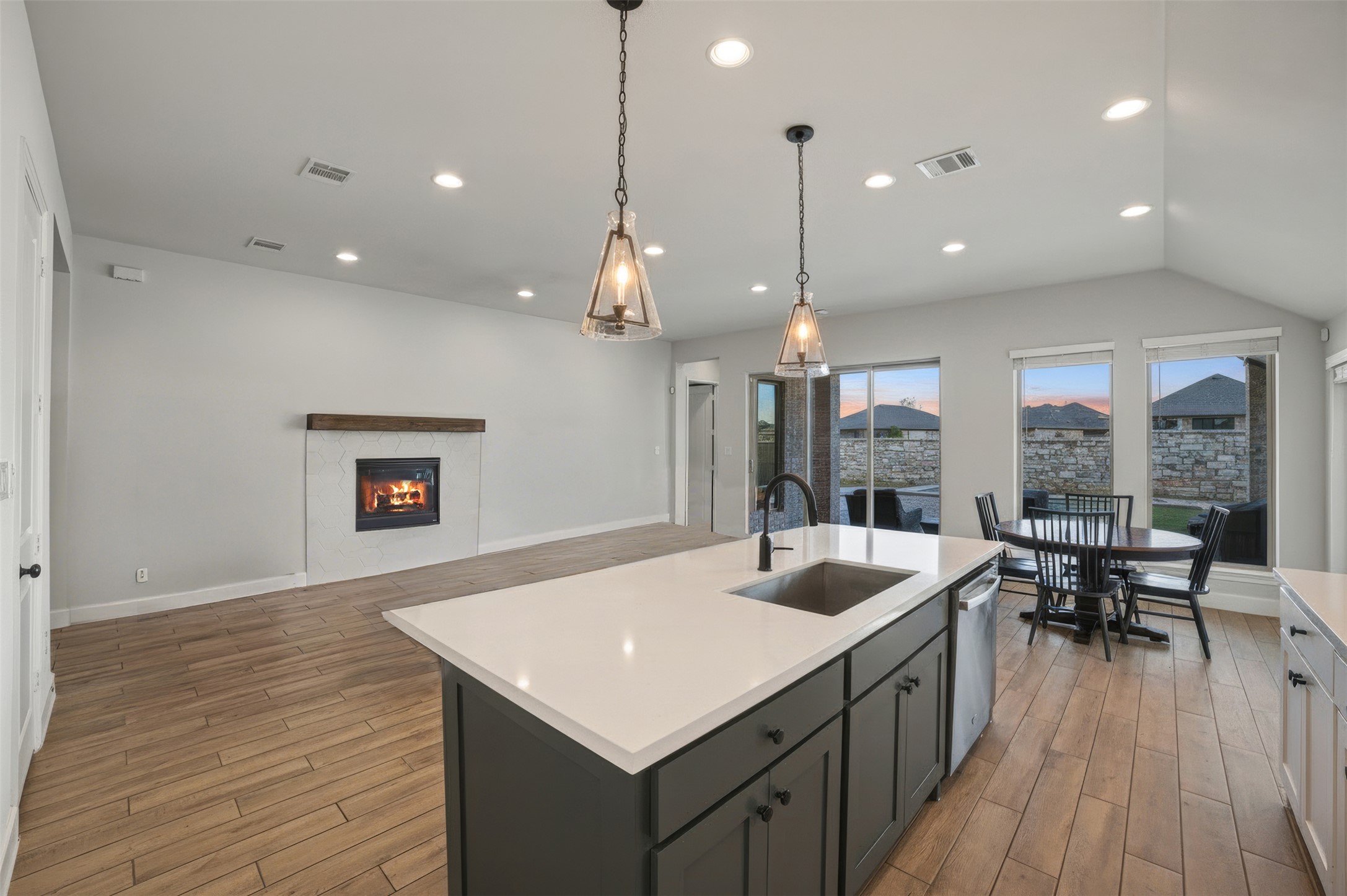 186 Prickly Poppy Loop Kyle, TX 78640 - Photo 40 of 40 a kitchen with a sink a counter space appliances and wooden floor