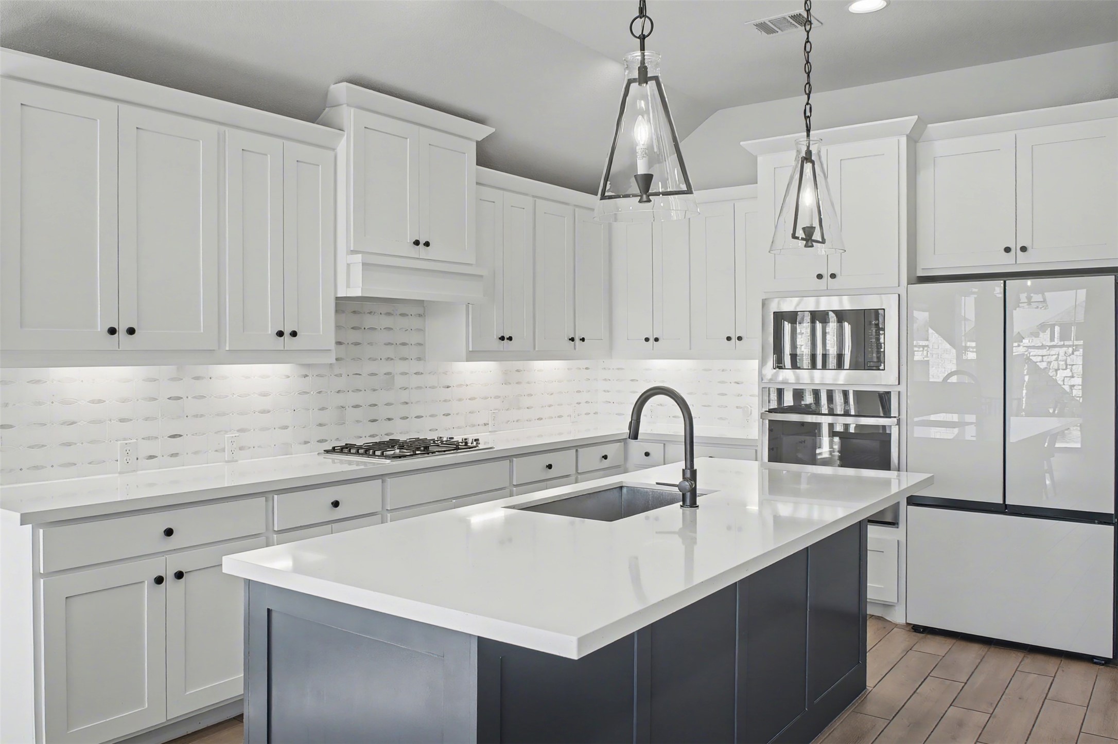 186 Prickly Poppy Loop Kyle, TX 78640 - Photo 8 of 40 a kitchen with stainless steel appliances granite countertop a sink a stove and a refrigerator