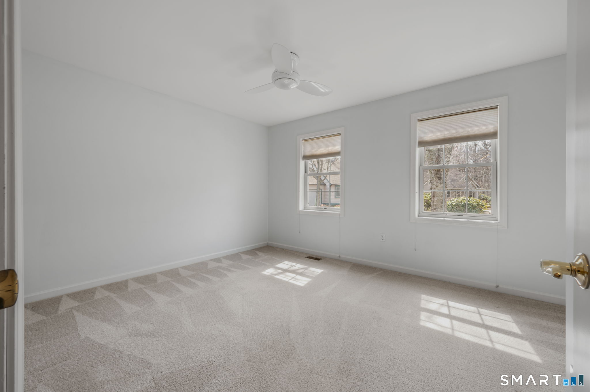 1 Bittersweet Lane, Unit 1 East Lyme, CT 06357 - Photo 13 of 26 an empty room with windows