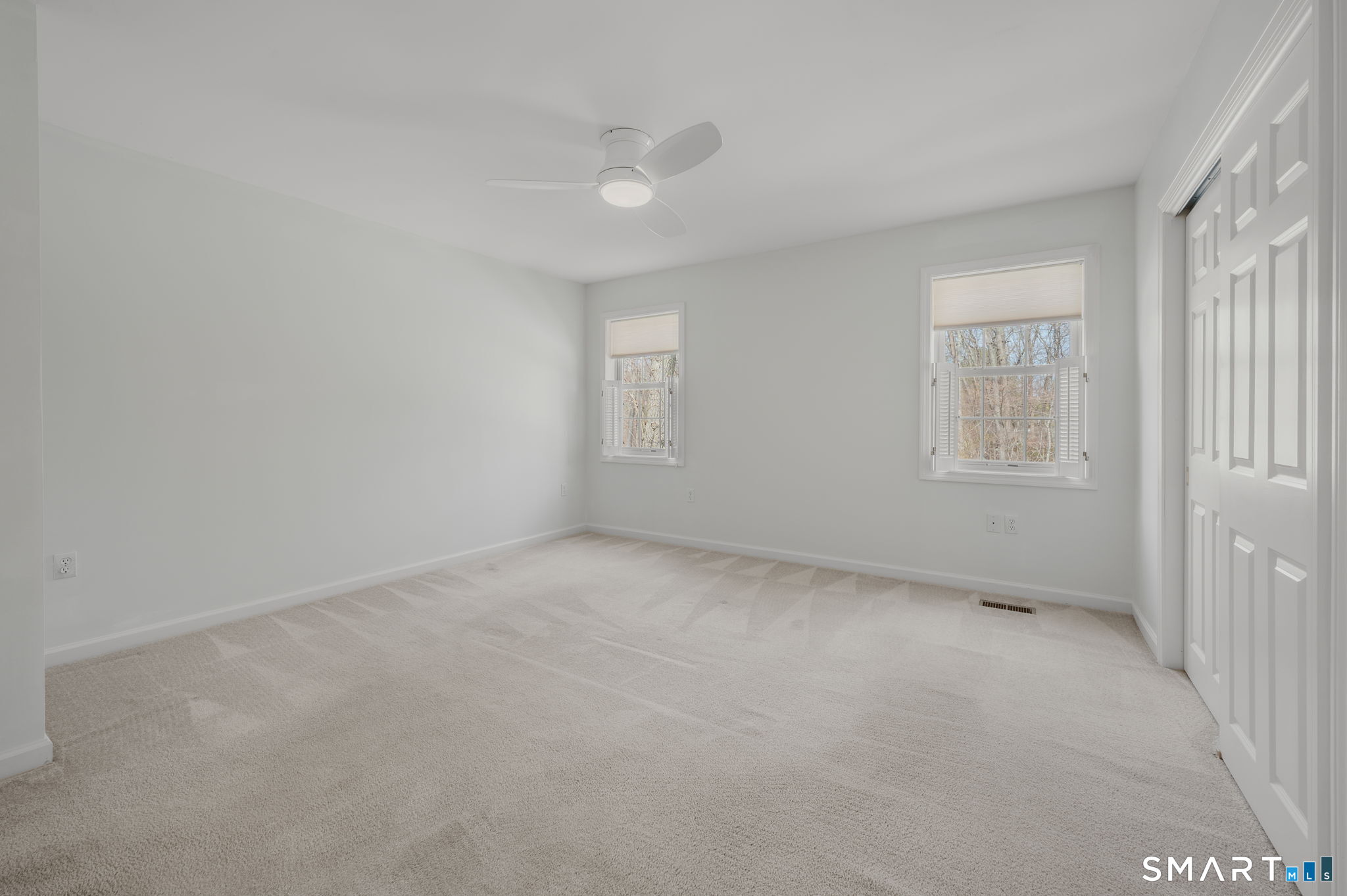 1 Bittersweet Lane, Unit 1 East Lyme, CT 06357 - Photo 18 of 26 an empty room with windows