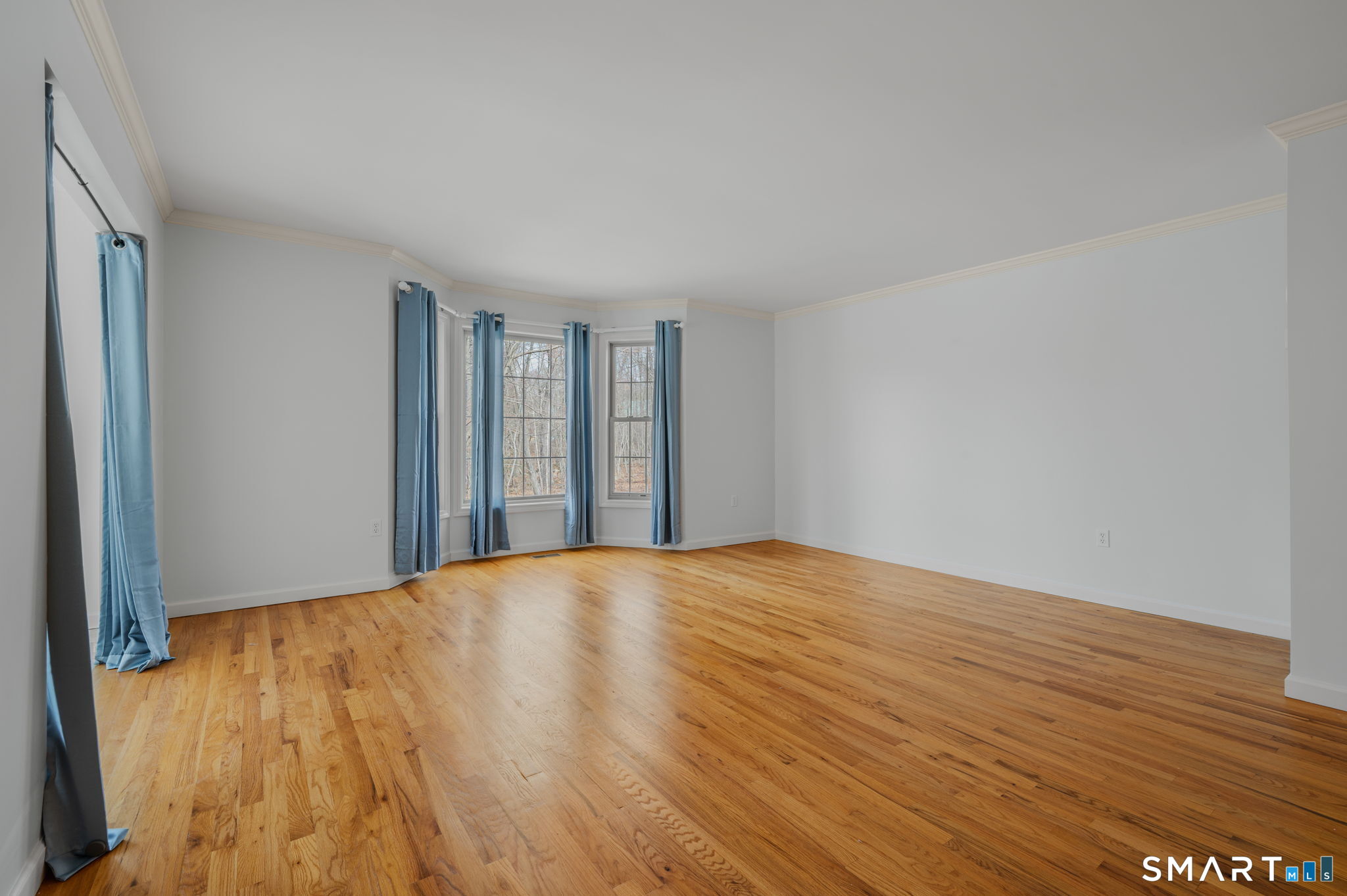 1 Bittersweet Lane, Unit 1 East Lyme, CT 06357 - Photo 10 of 26 a view of an empty room with wooden floor