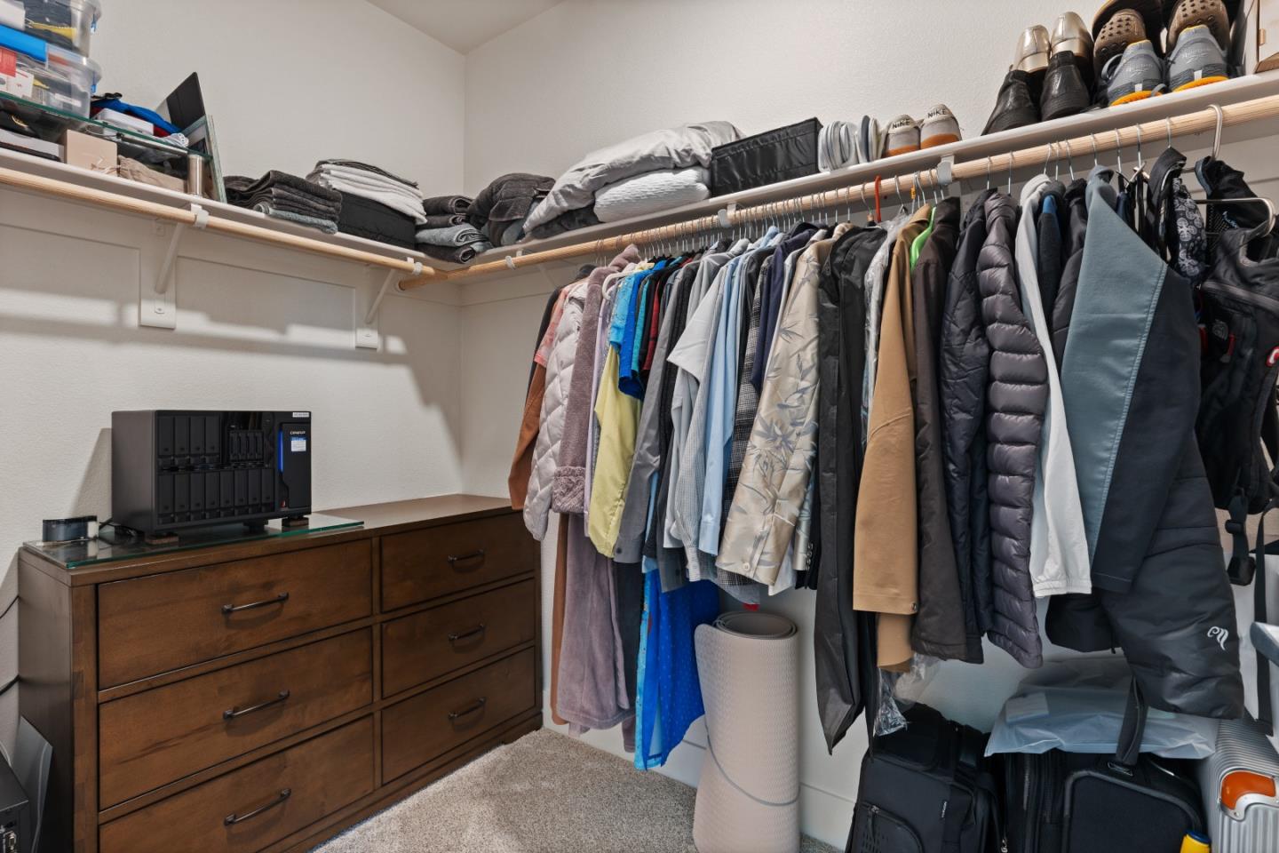 1853 Almaden Road, Unit 504 San Jose, CA 95125 - Photo 13 of 18 a view of walk in closet with clothes and shoes