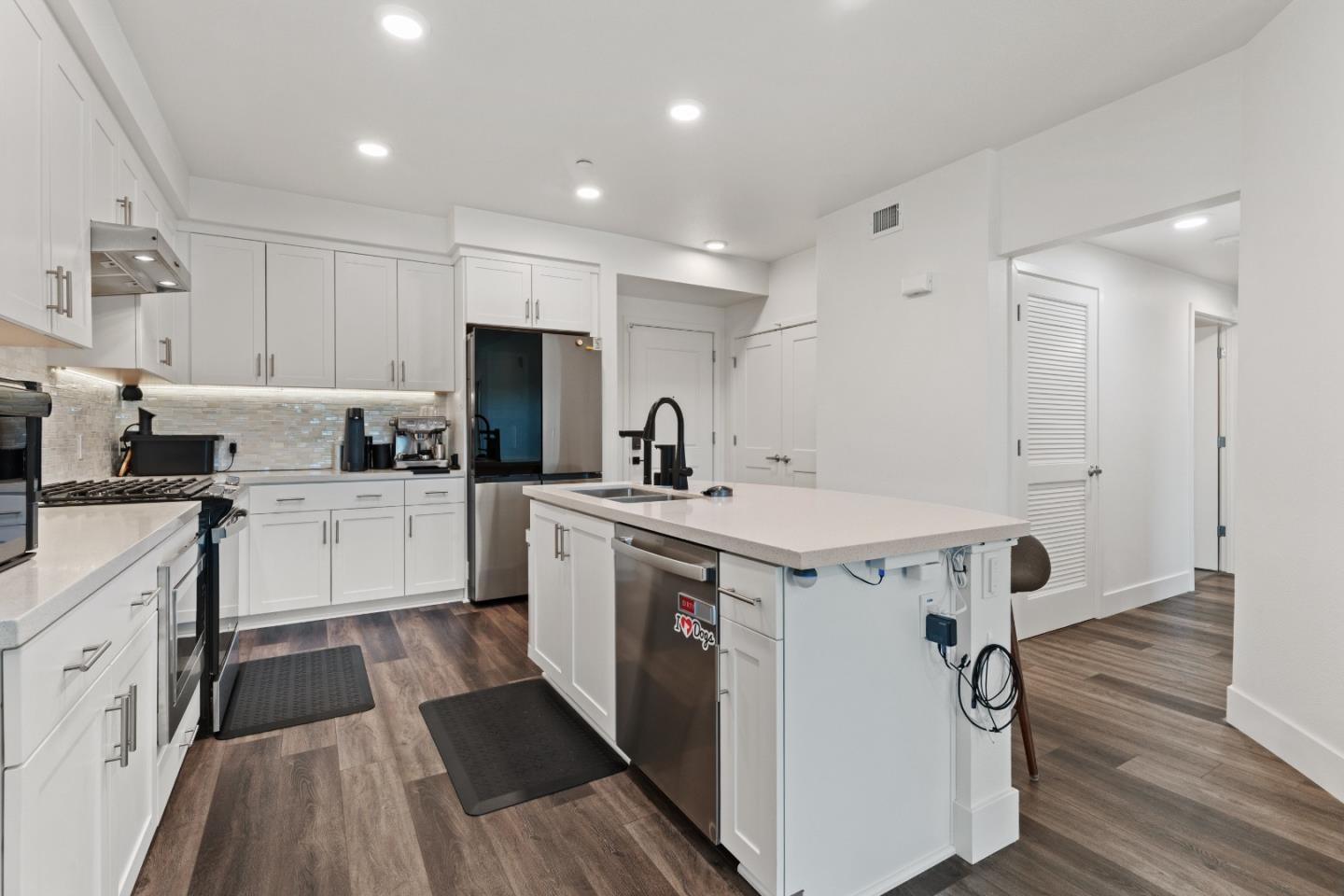 1853 Almaden Road, Unit 504 San Jose, CA 95125 - Photo 7 of 18 a kitchen with a sink a stove a refrigerator and cabinets