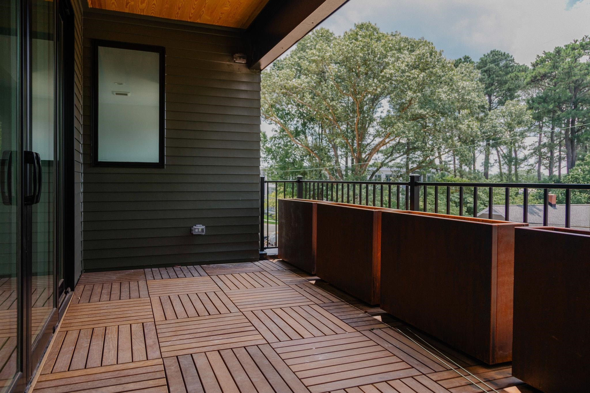 1412 Lyon Street, Unit 101 Raleigh, NC 27608 - Photo 18 of 42 a view of wooden balcony