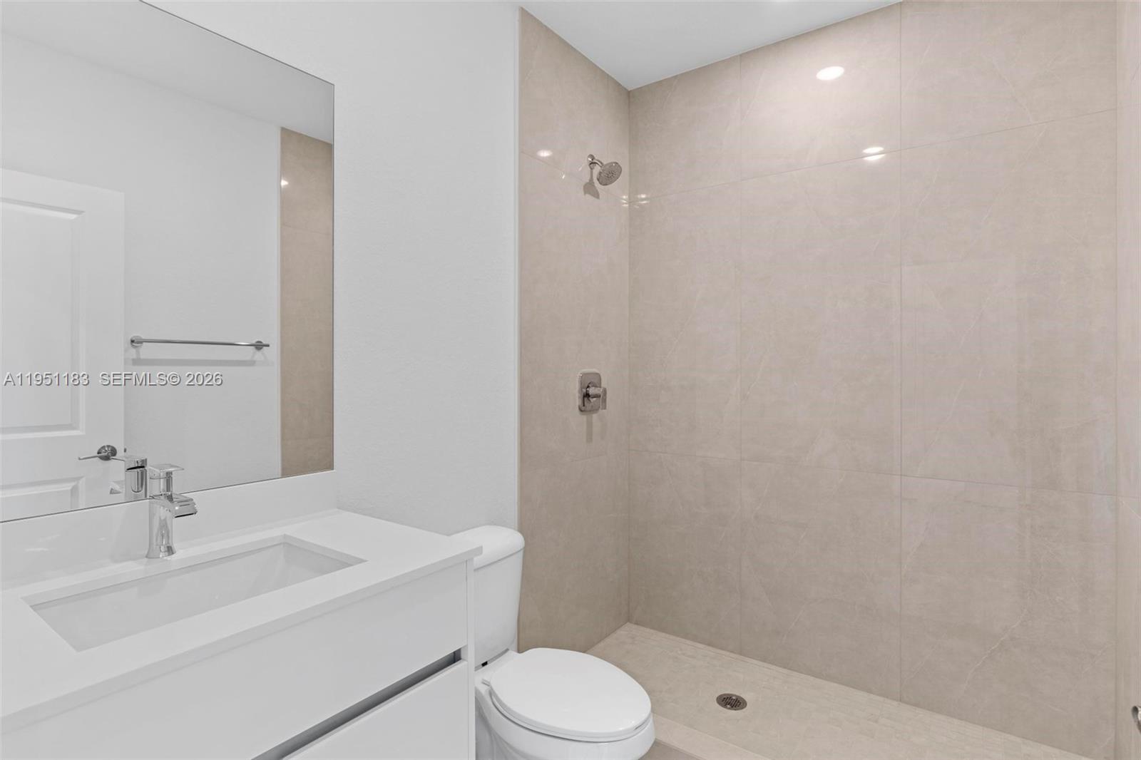 13361 Southwest 272nd Lane Homestead, FL 33032 - Photo 14 of 27 a bathroom with a sink toilet and shower