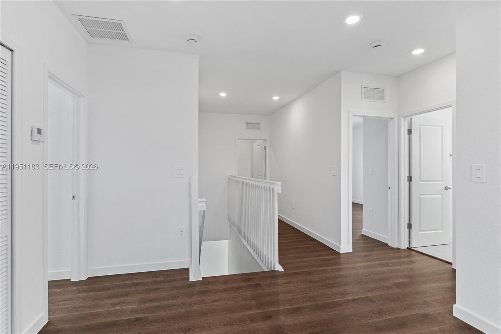 13361 Southwest 272nd Lane Homestead, FL 33032 - Photo 16 of 27 a view of empty room with wooden floor