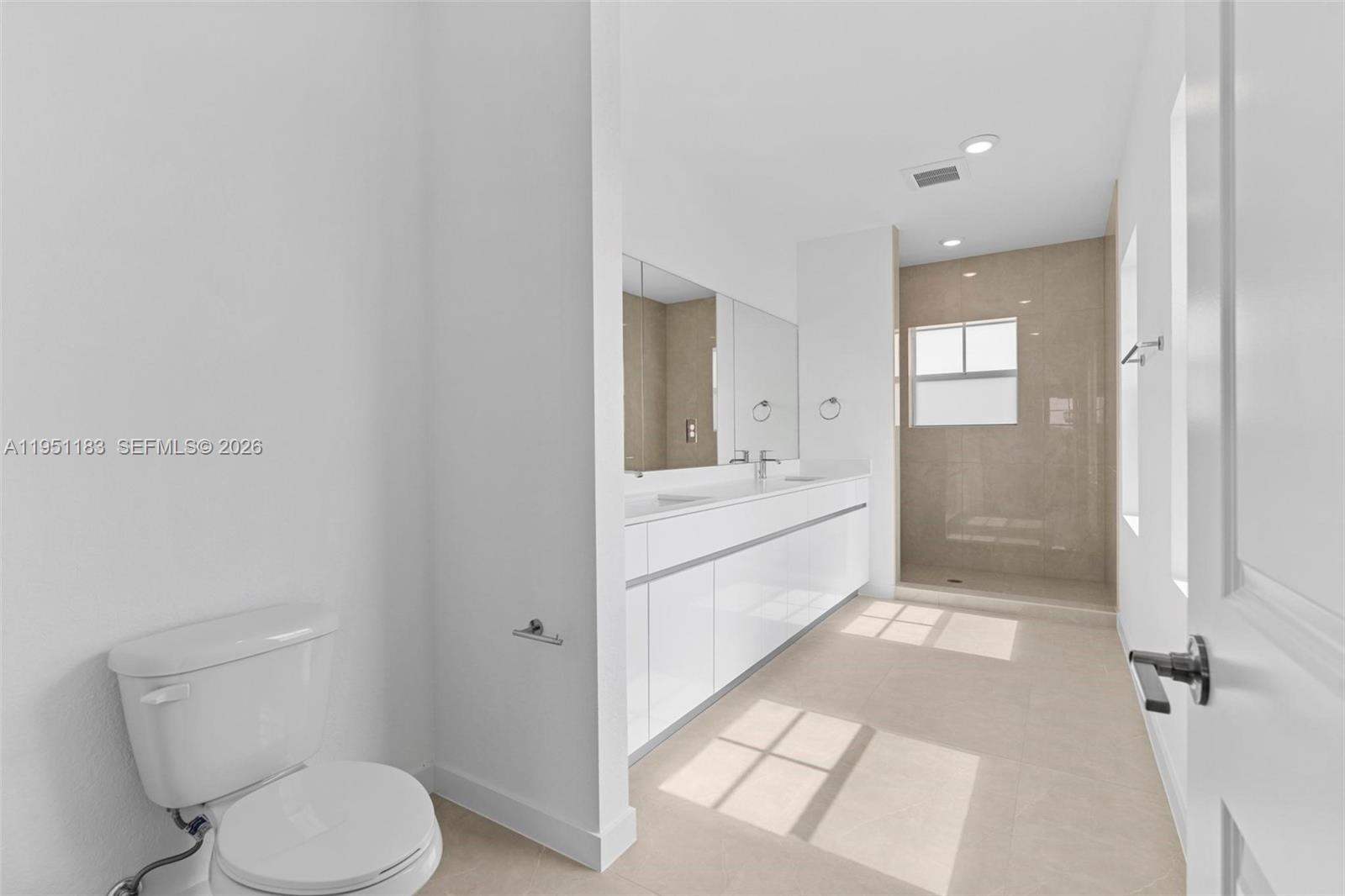 13361 Southwest 272nd Lane Homestead, FL 33032 - Photo 20 of 27 a bathroom with a sink a toilet and shower