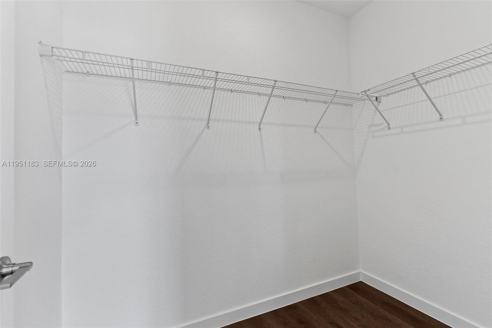 13361 Southwest 272nd Lane Homestead, FL 33032 - Photo 22 of 27 a view of a room with racks on the wall