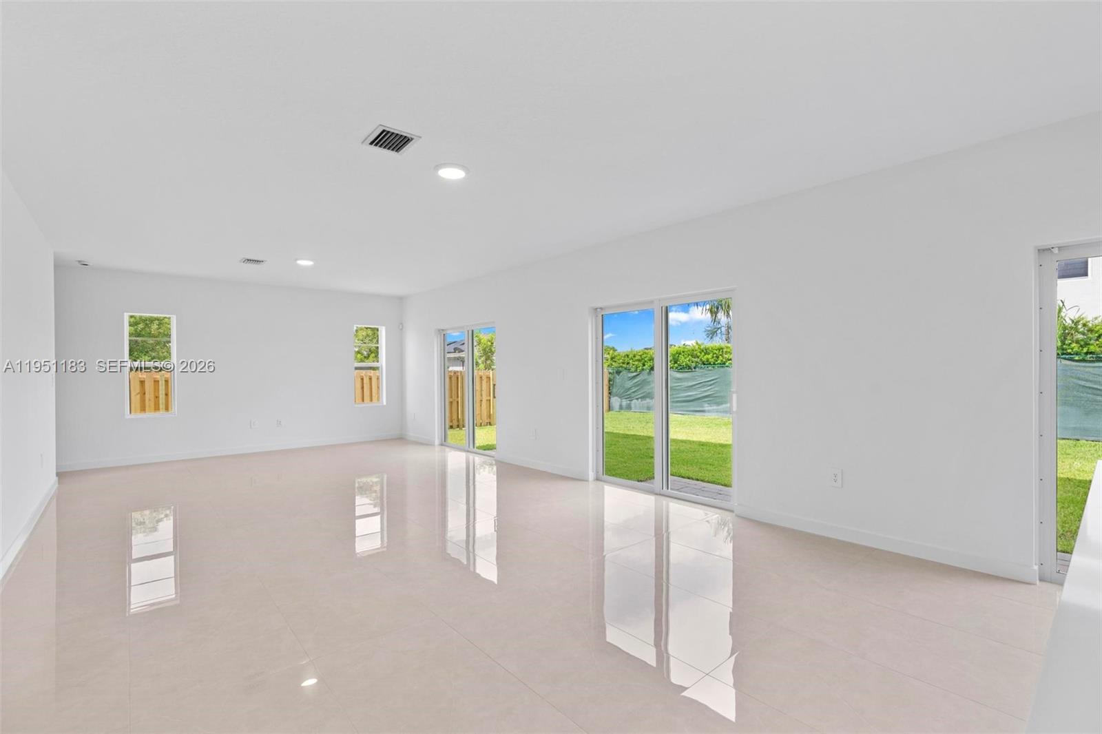 13361 Southwest 272nd Lane Homestead, FL 33032 - Photo 7 of 27 a view of an empty room with a window