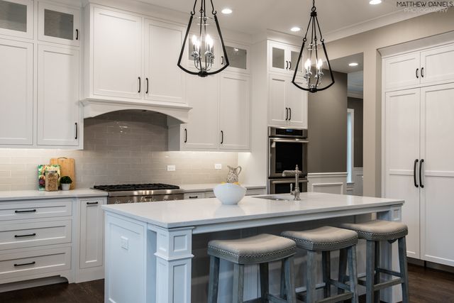 a kitchen with a sink cabinets and stainless steel appliances