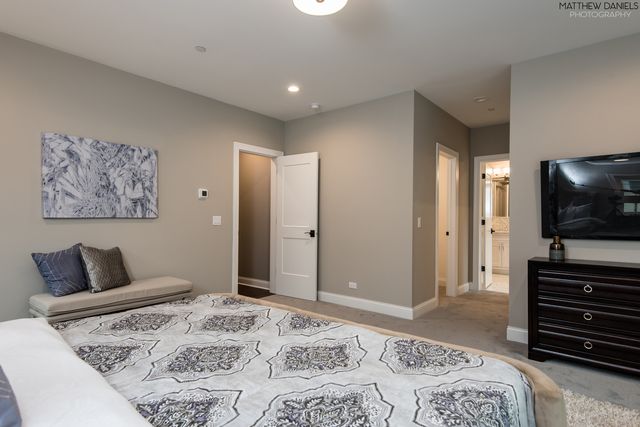 a bedroom with a bed and television