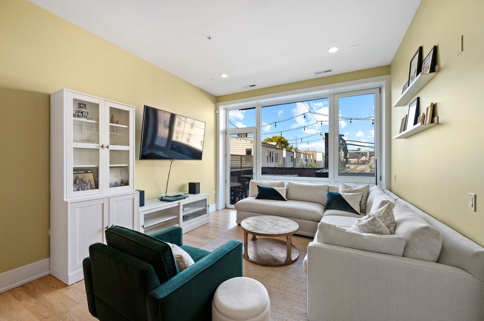 3101 North Ridgeway Avenue, Unit 2E Chicago, IL 60618 - Photo 2 of 18 a living room with furniture and a large window