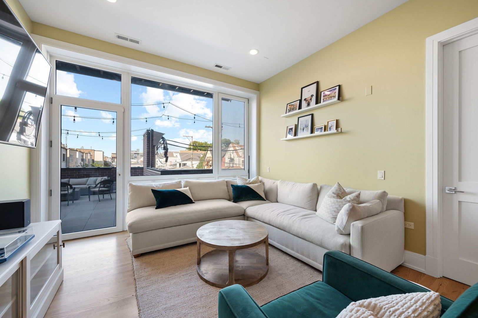 3101 North Ridgeway Avenue, Unit 2E Chicago, IL 60618 - Photo 3 of 18 a living room with furniture and a large window