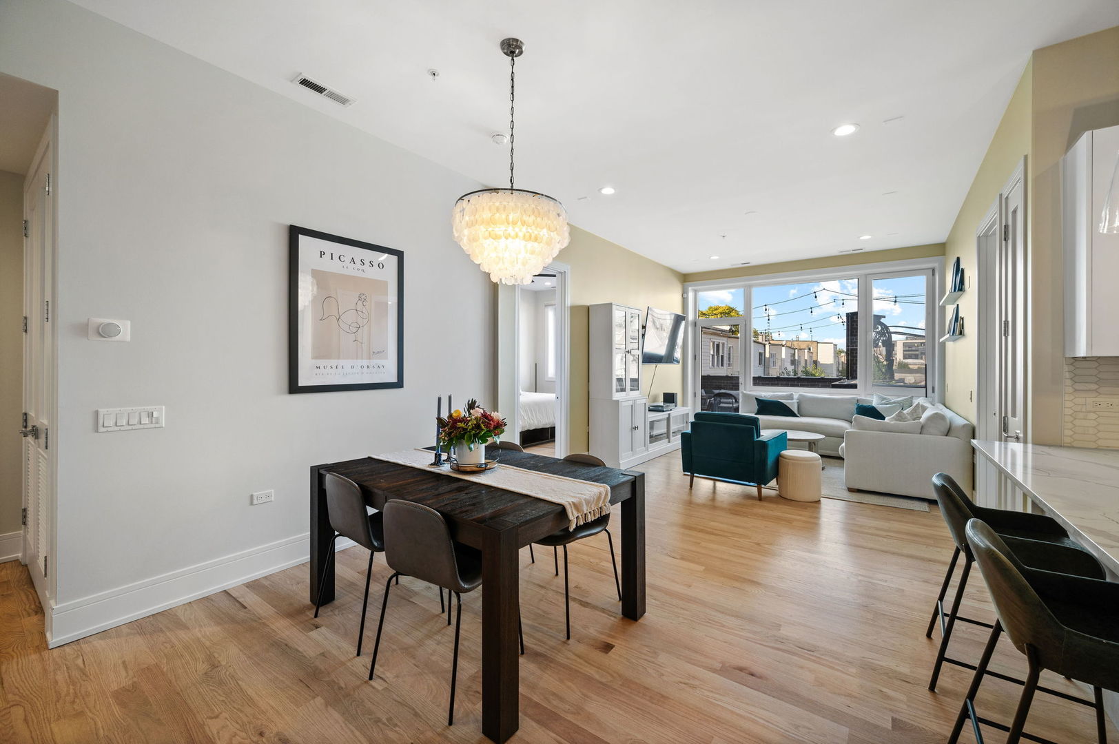 3101 North Ridgeway Avenue, Unit 2E Chicago, IL 60618 - Photo 4 of 18 a view of a dining room with furniture window and wooden floor