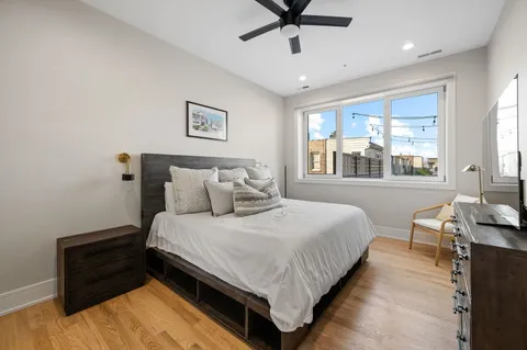 a bedroom with bed and window