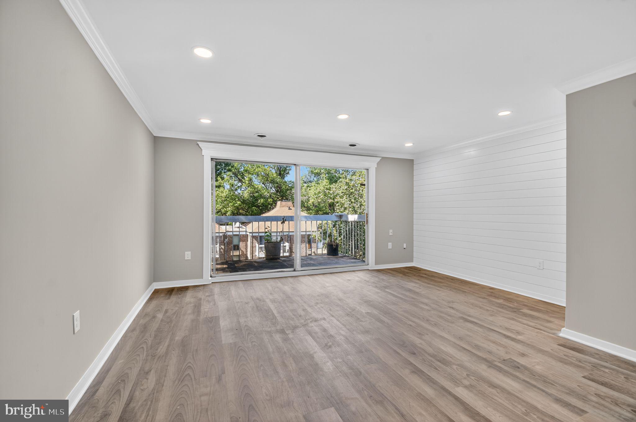 3234 Hewitt Avenue, Unit 34B Silver Spring, MD 20906 - Photo 3 of 17 a view of a room with wooden floor and furniture