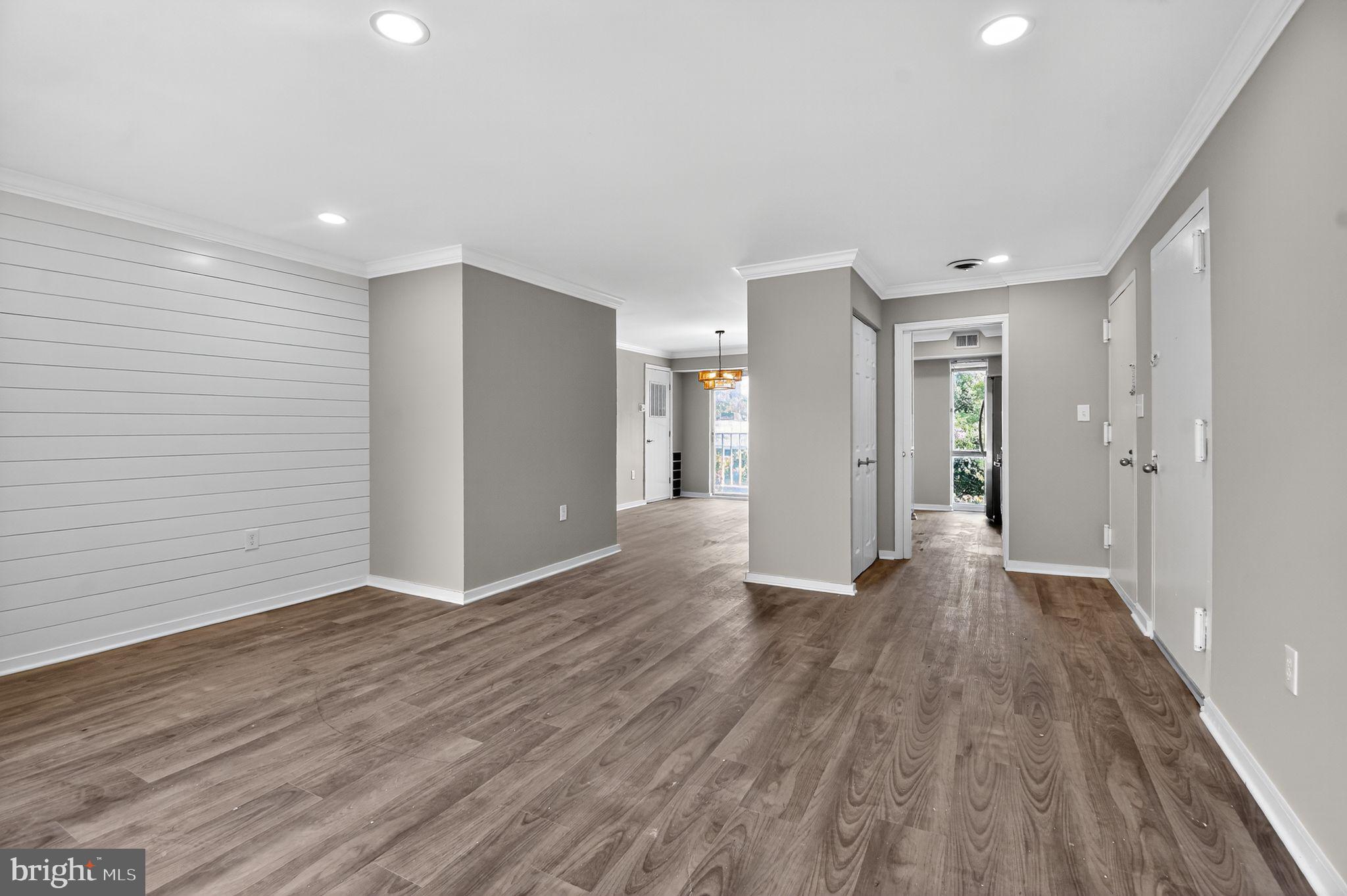 3234 Hewitt Avenue, Unit 34B Silver Spring, MD 20906 - Photo 4 of 17 a view of an empty room with wooden floor