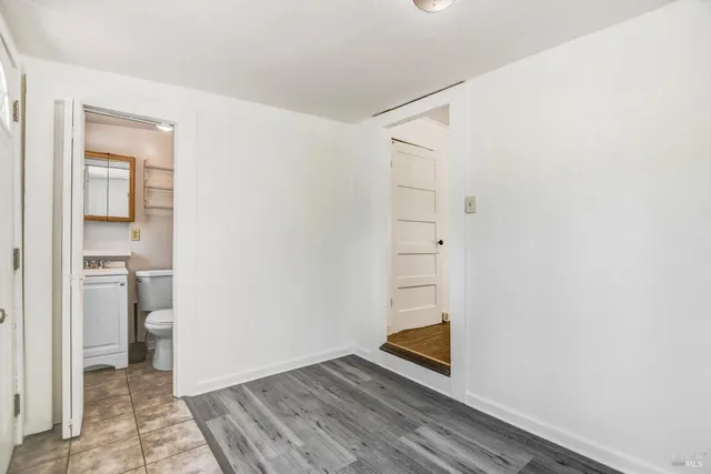 a view of balcony with wooden floor