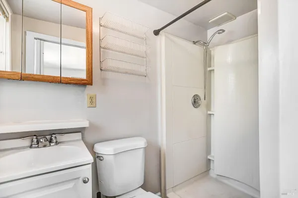 a pathway of a house with a yard