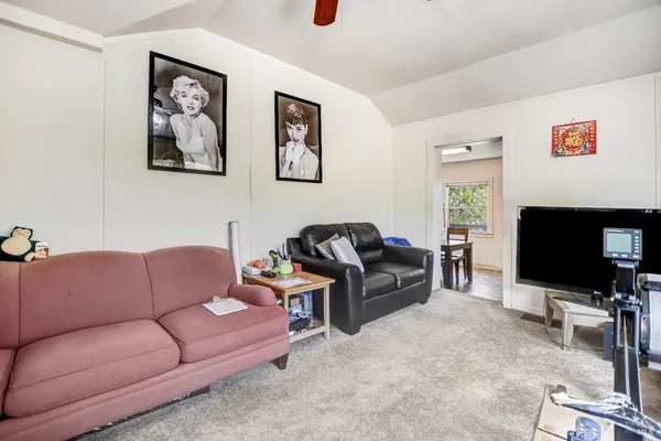 a view of a dining table and chairs in a room