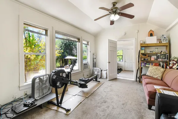 a kitchen with white cabinets and a stove