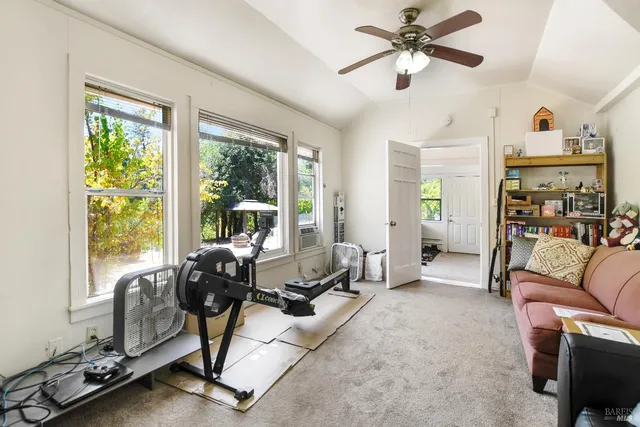 a kitchen with white cabinets and a stove