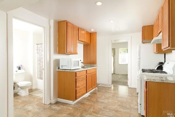 a view of a kitchen with a sink cabinets and a window