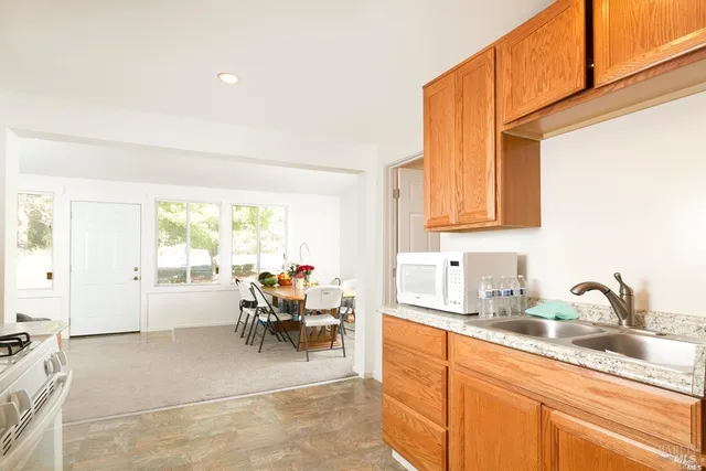 a view of a hallway with washer and dryer