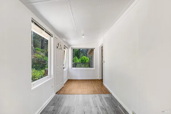 a kitchen with a refrigerator and a stove
