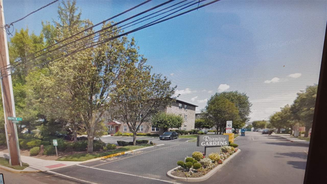 48 Riverview Court, Unit 48 Secaucus, NJ 07094 - Photo 1 of 1 a view of a street with cars park