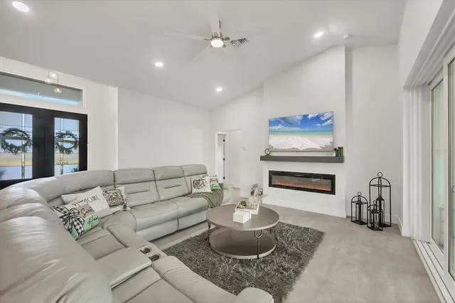 a kitchen with sink stove and refrigerator