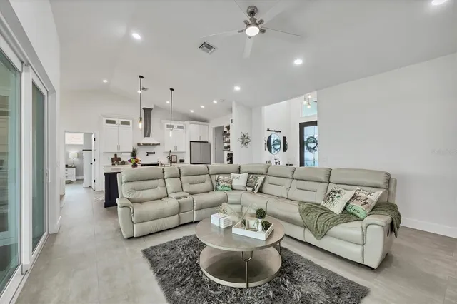 a kitchen with stainless steel appliances a sink stove and cabinets