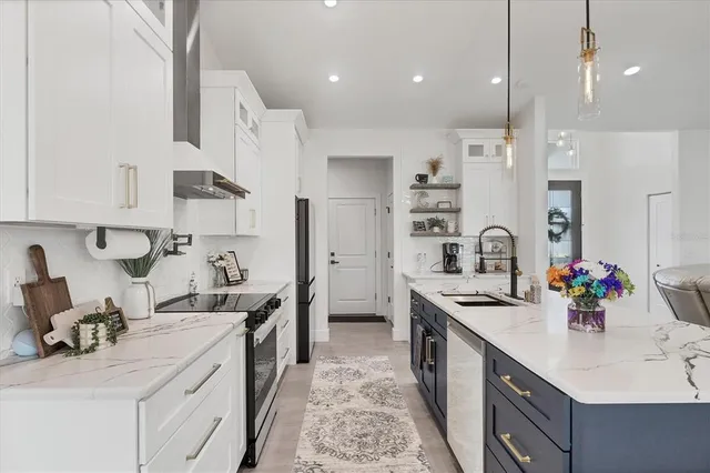 a bedroom with a bed and a view of living room