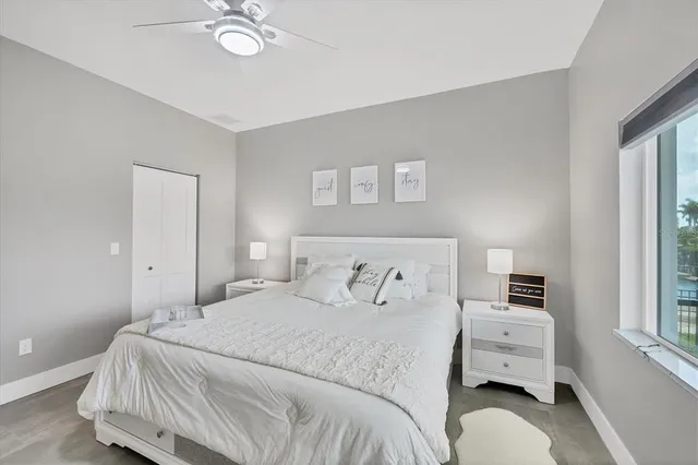a view of a dining room with furniture water view and a chandelier