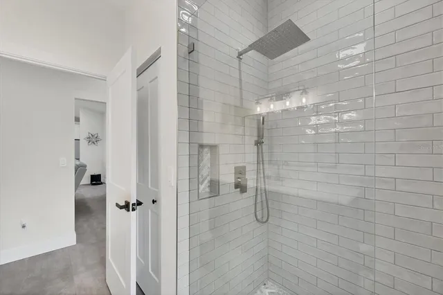 a view of a house with a yard patio and fire pit