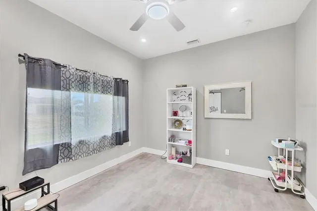 a swimming pool with outdoor seating and yard