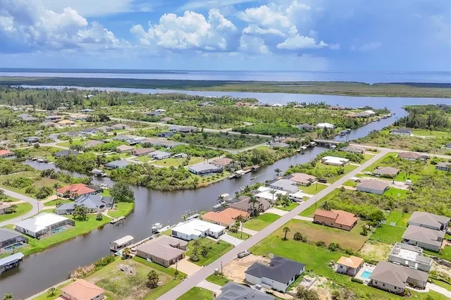 an aerial view of a house with a lake view