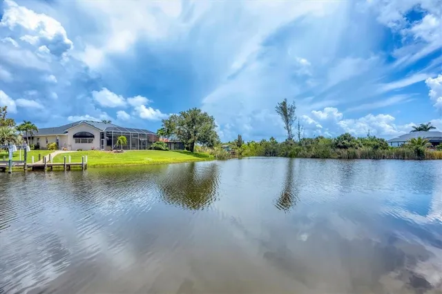a sign board with a building in the background