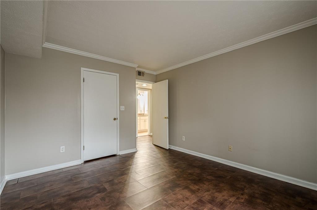 1106 Natchez Trace Atlanta, GA 30350 - Photo 24 of 40 a view of an empty room and wooden floor