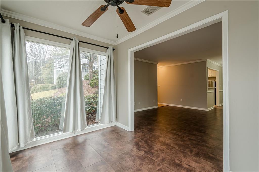 1106 Natchez Trace Atlanta, GA 30350 - Photo 37 of 40 an empty room with windows and chandelier