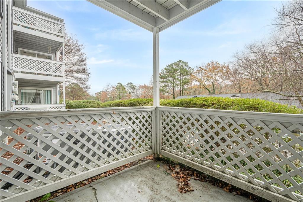 1106 Natchez Trace Atlanta, GA 30350 - Photo 39 of 40 a view of a balcony with wooden fence