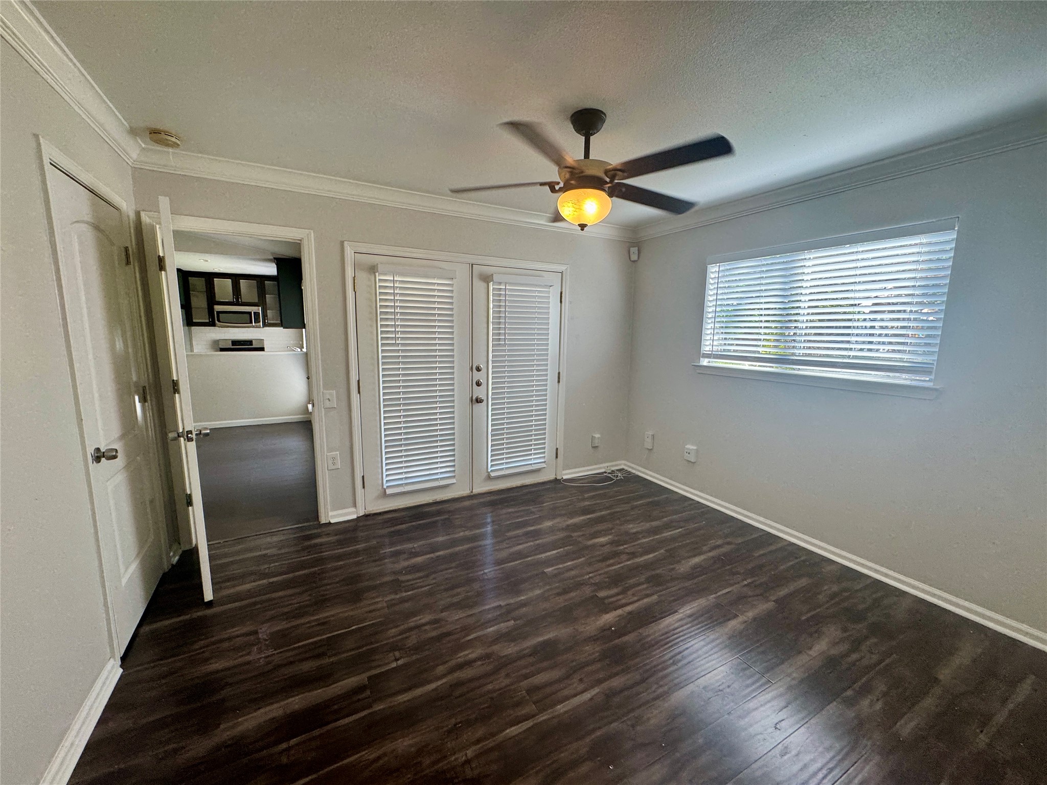 7315 Lunar Drive Austin, TX 78745 - Photo 12 of 17 an empty room with wooden floor and window