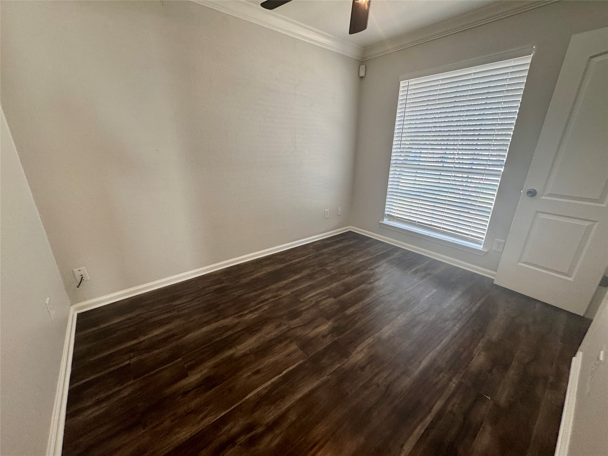 7315 Lunar Drive Austin, TX 78745 - Photo 14 of 17 a view of an empty room with wooden floor and a window