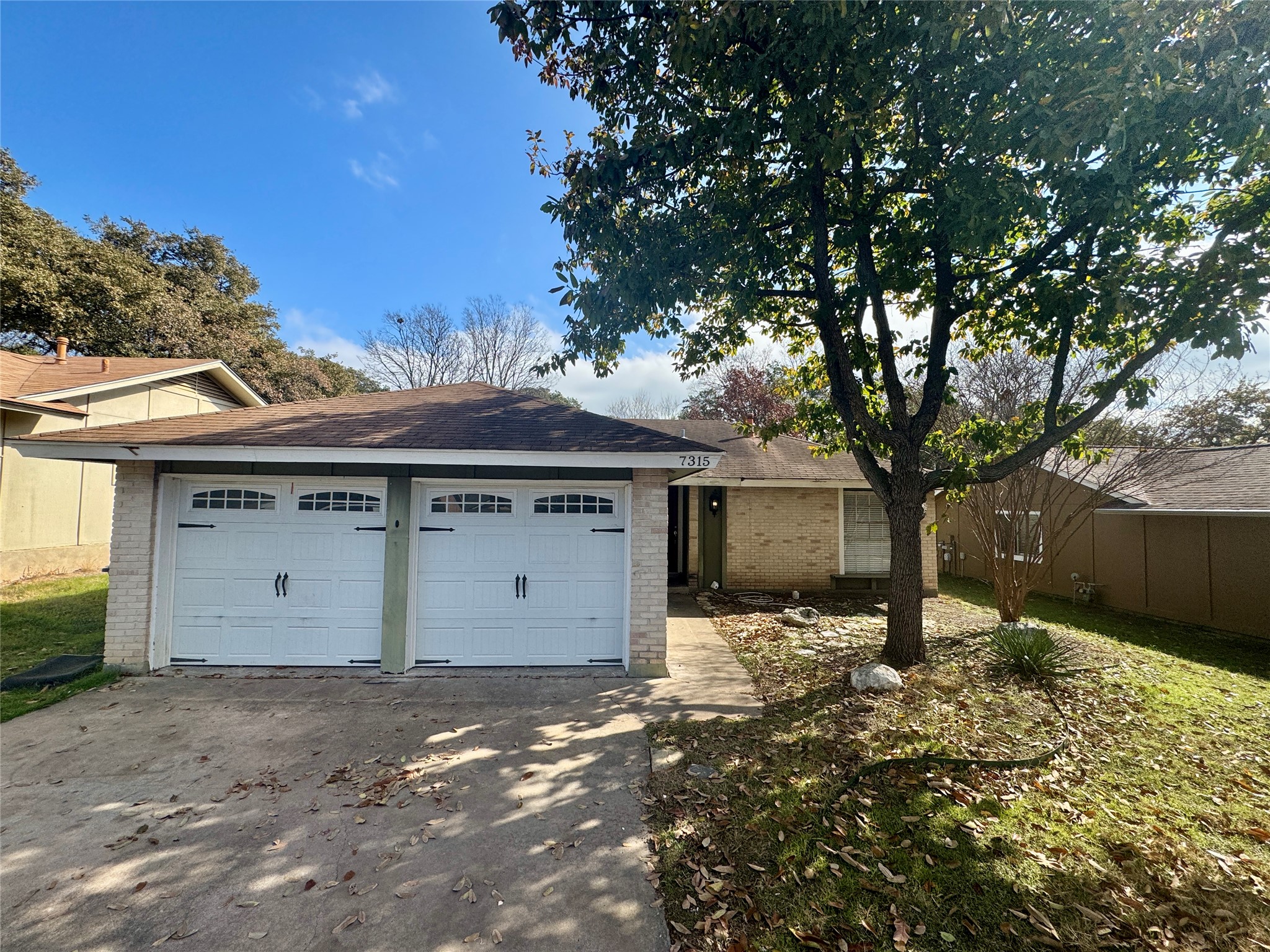 7315 Lunar Drive Austin, TX 78745 - Photo 2 of 17 a view of a house with a yard