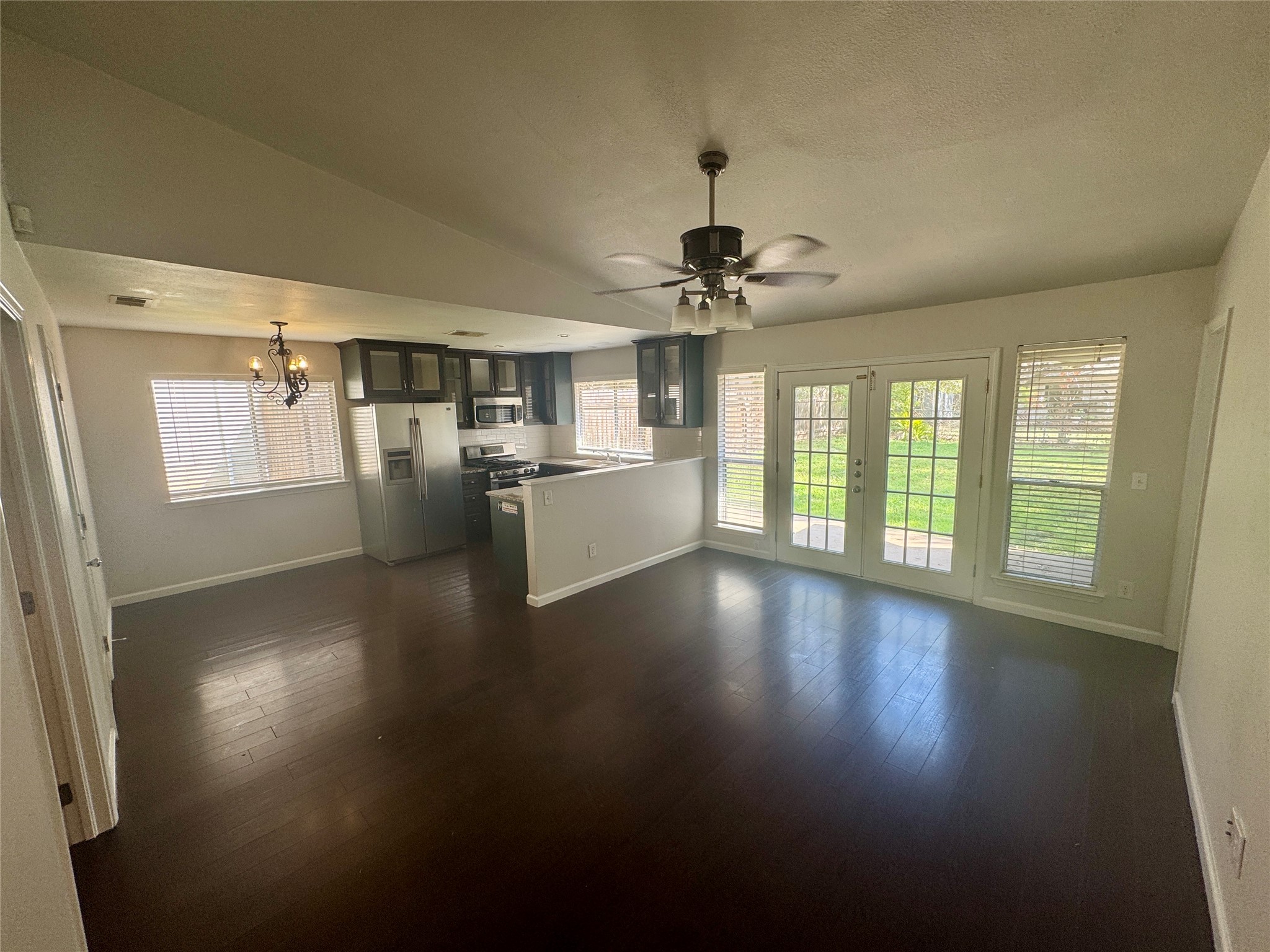 7315 Lunar Drive Austin, TX 78745 - Photo 3 of 17 a view of a livingroom with furniture wooden floor and chandelier