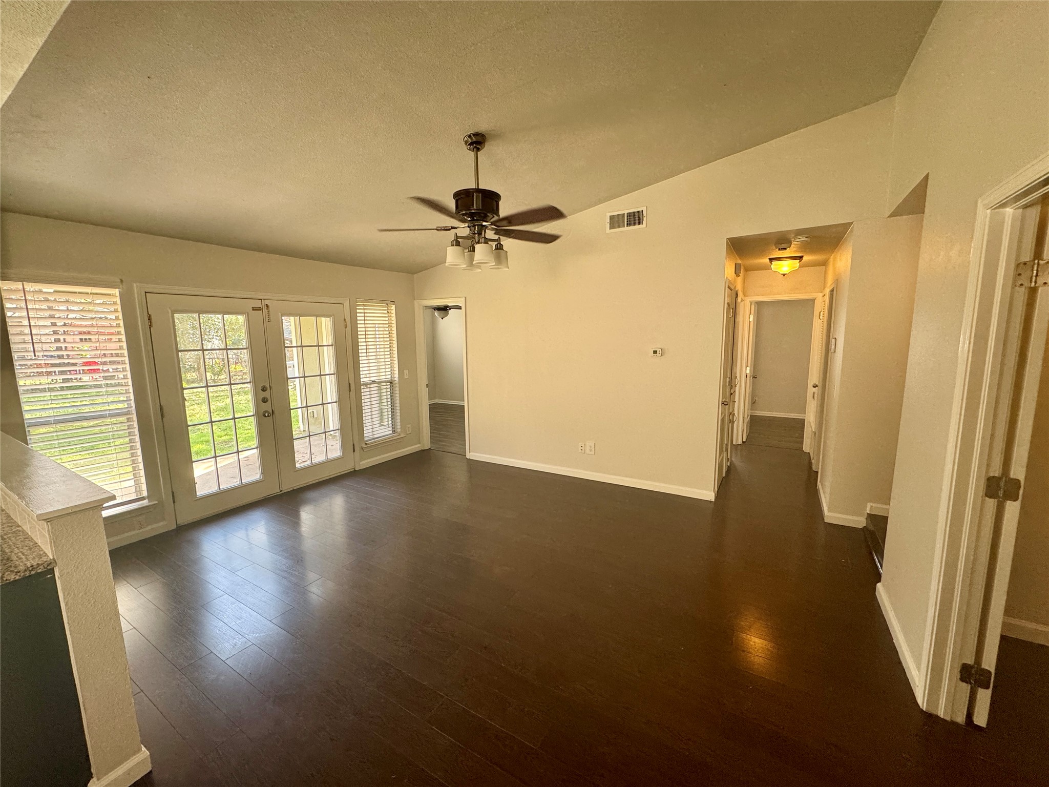 7315 Lunar Drive Austin, TX 78745 - Photo 4 of 17 wooden floor in an empty room with a window