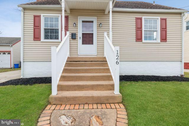 126 4th Avenue Mount Ephraim, NJ 08059 - Photo 1 of 26 a front view of a house with a garden