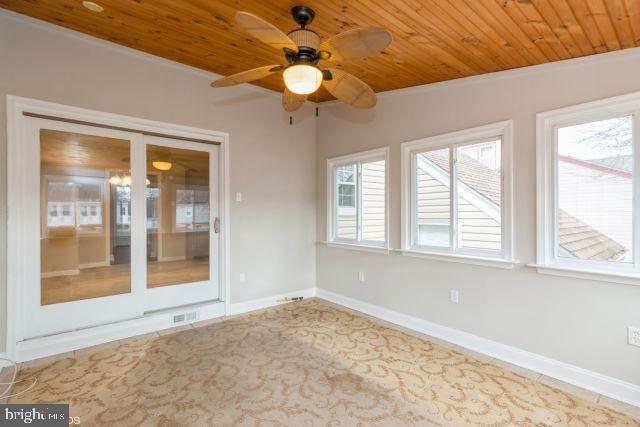126 4th Avenue Mount Ephraim, NJ 08059 - Photo 13 of 26 a view of an empty room with window and chandelier fan