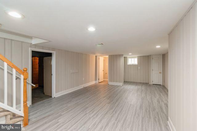 126 4th Avenue Mount Ephraim, NJ 08059 - Photo 15 of 26 a view of an empty room with wooden floor and stairs